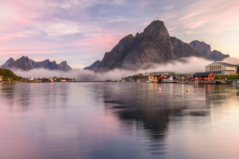 Reine reflecting in fjord
